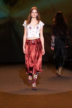 white embroidered top and red velvet skirt
