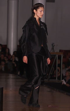 black silk fitted jacket and relaxed pants