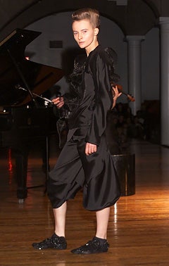 black silk ruffled jacket and wide-leg pants