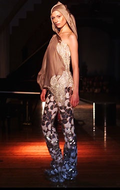 beige asymmetric top with multi flared pants