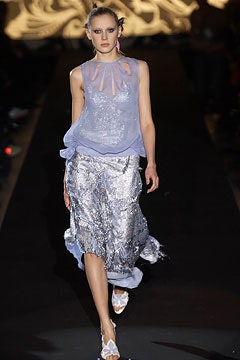 blue silk sleeveless top and silver skirt