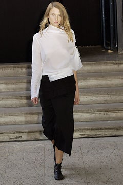 white silk fitted top and black skirt