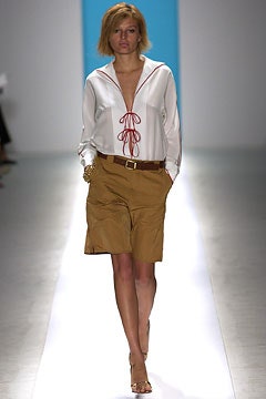 white relaxed shirt with brown shorts