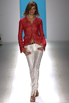 red fitted jacket with white pants
