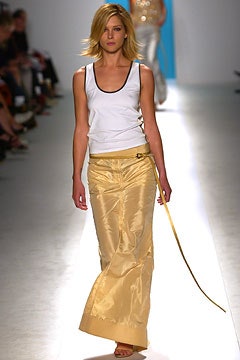 white fitted top and gold pants