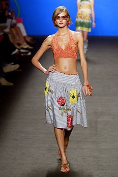 orange halter top and gray embroidered skirt