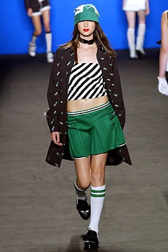 black and white striped top with green skirt