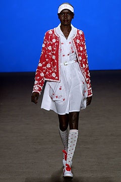 red embroidered jacket with white dress