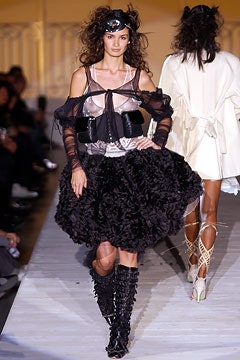 black ruffled mini dress with knee-high boots