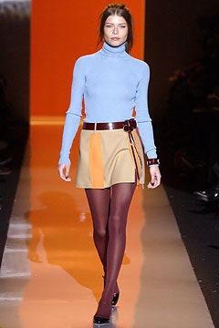 blue fitted turtleneck with asymmetric skirt