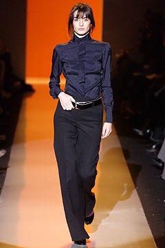 fitted blue shirt and tailored black pants