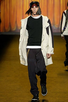 white coat black top and pants