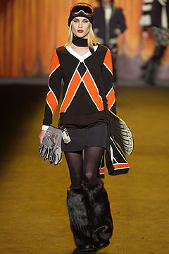 black and orange fitted top with skirt