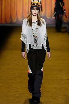 white cotton poncho and black pants