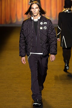 black quilted jacket with relaxed pants