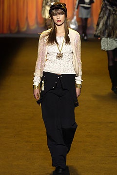 white silk fitted top and black relaxed pants