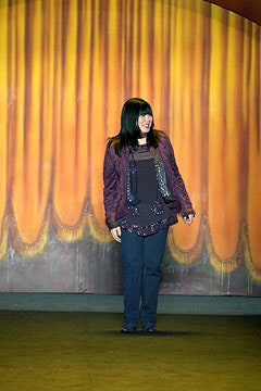 purple silk blouse and blue denim pants