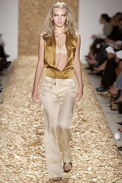 gold silk sleeveless top and beige wide-leg pants