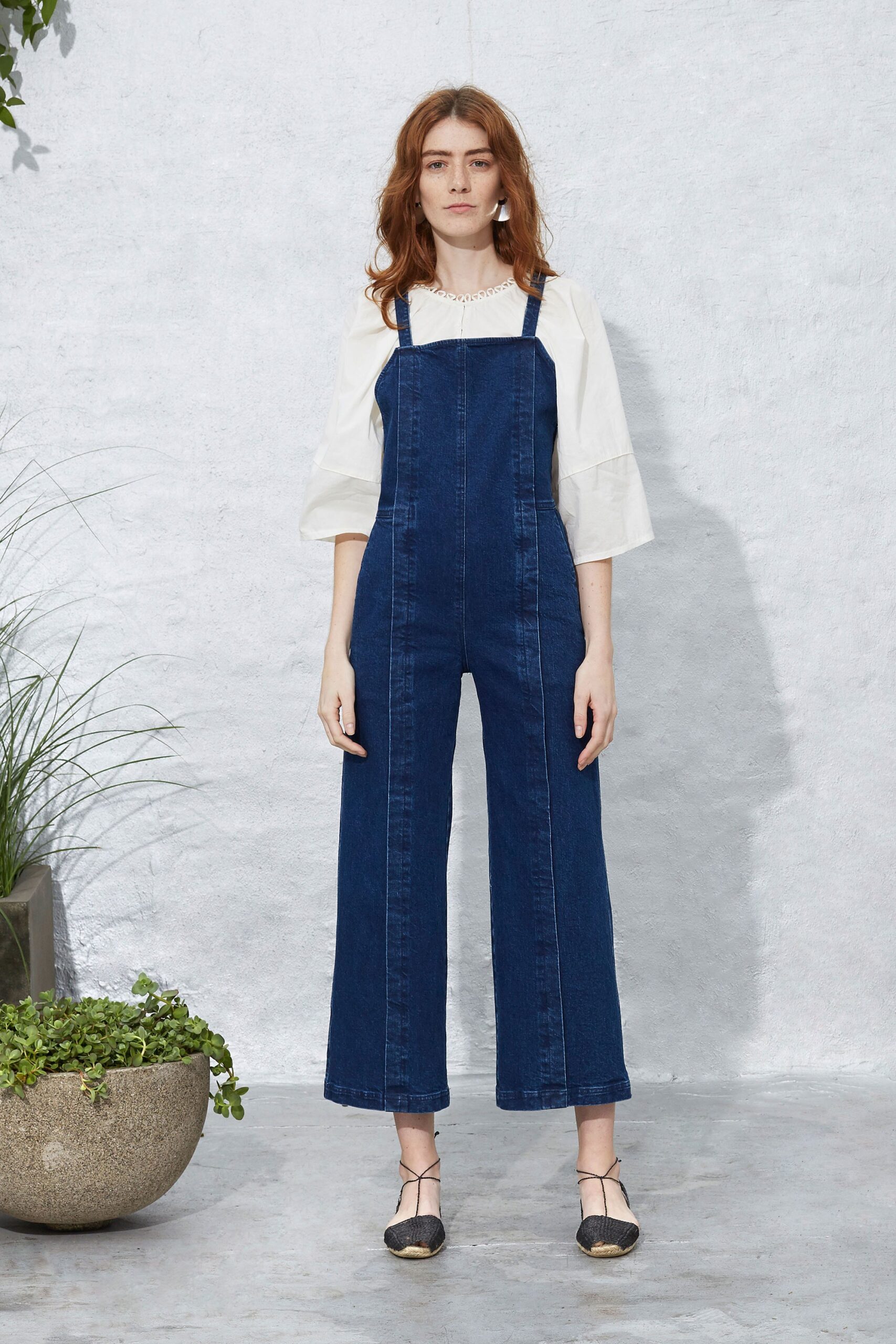blue denim overalls with white blouse