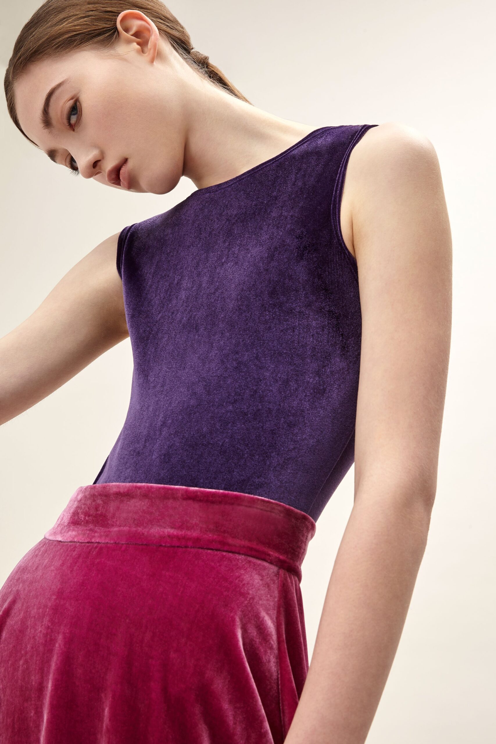 purple velvet bodysuit and pink skirt
