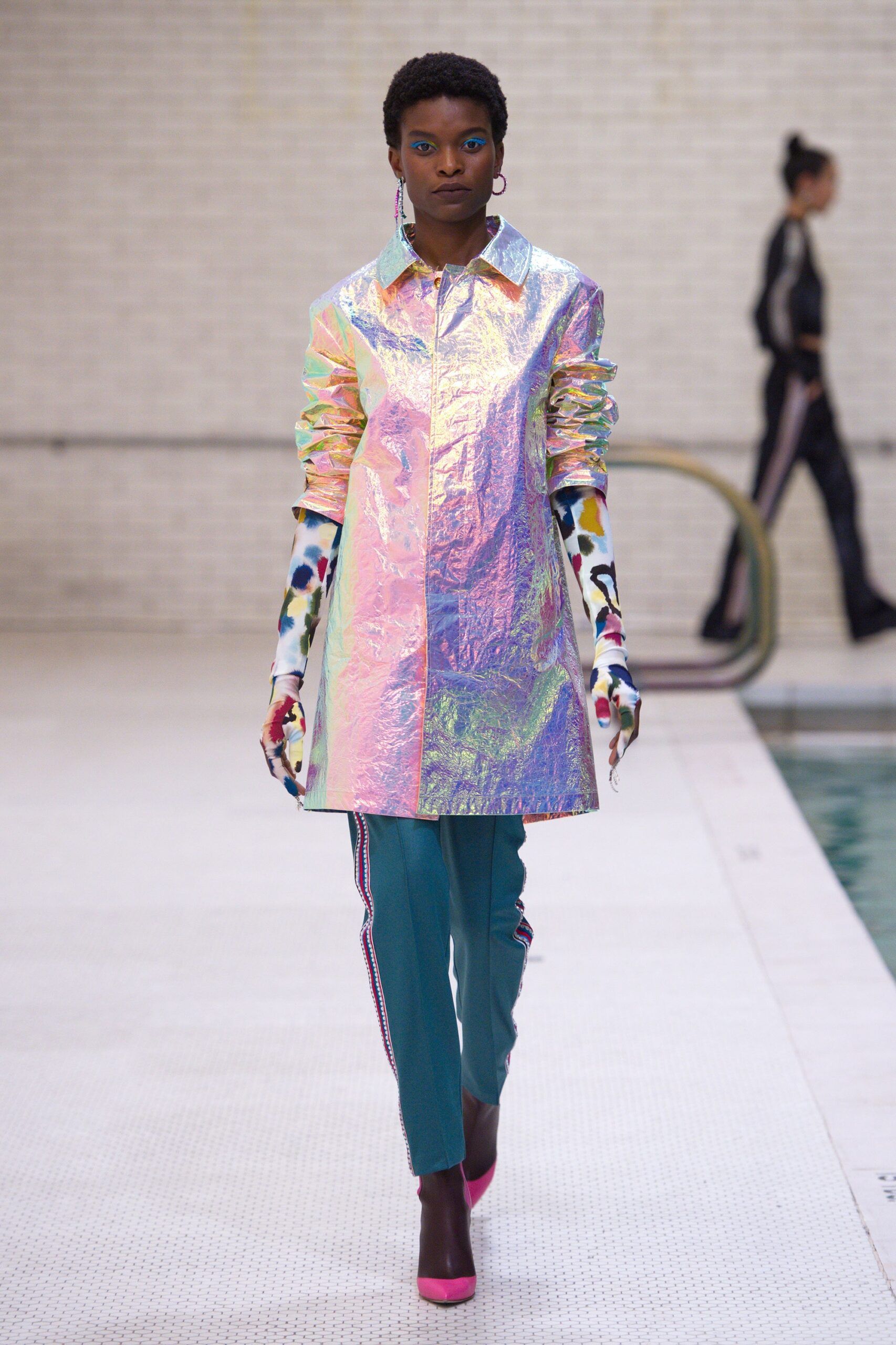 multi-colored vinyl coat with teal pants