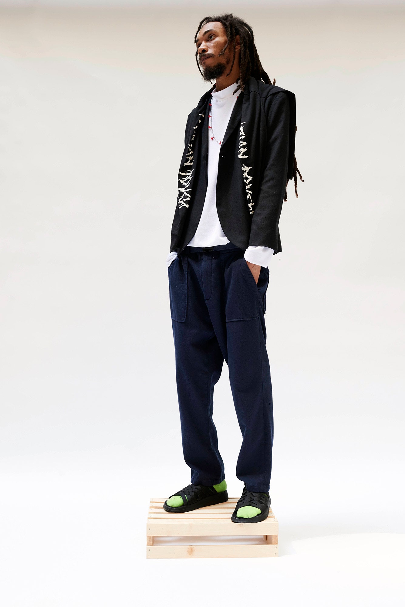black blazer white t-shirt blue pants