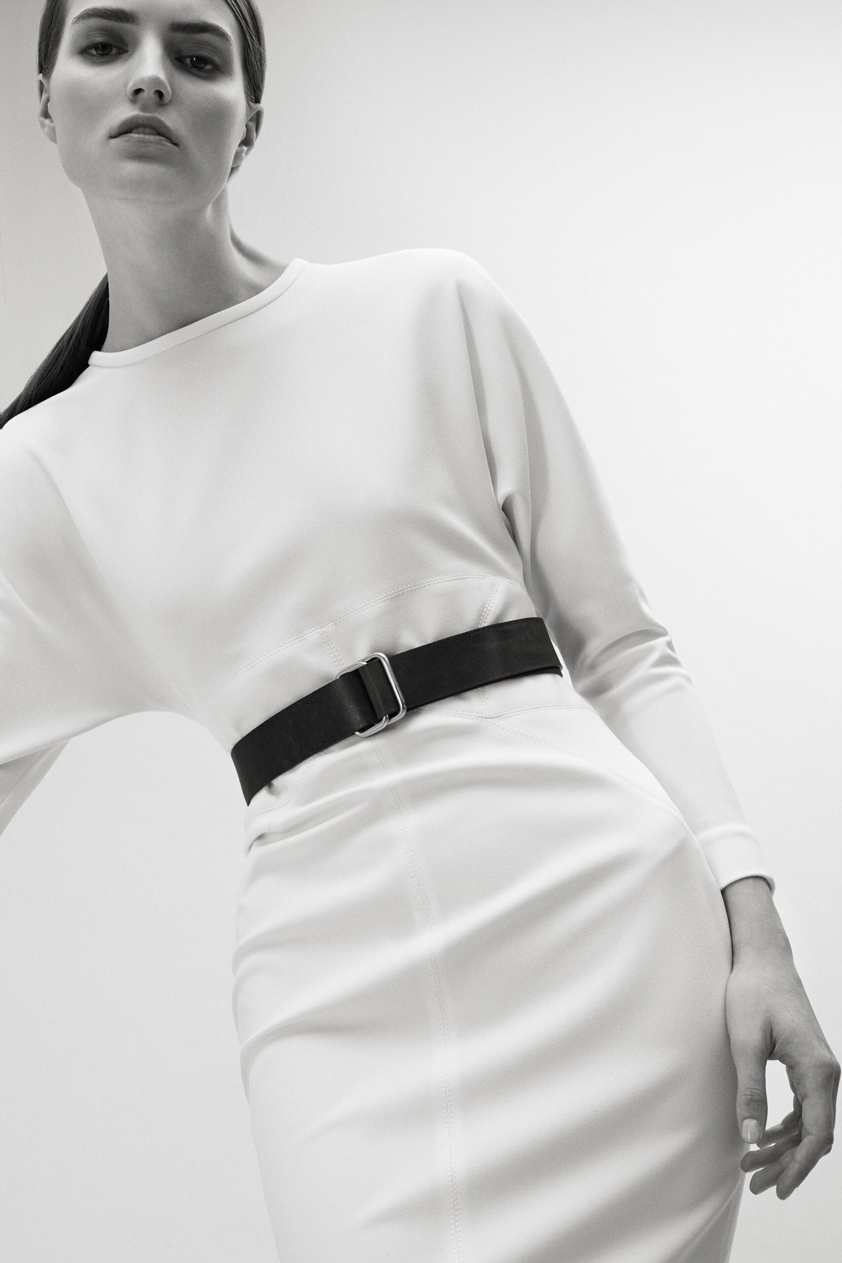 white fitted midi dress with black belt