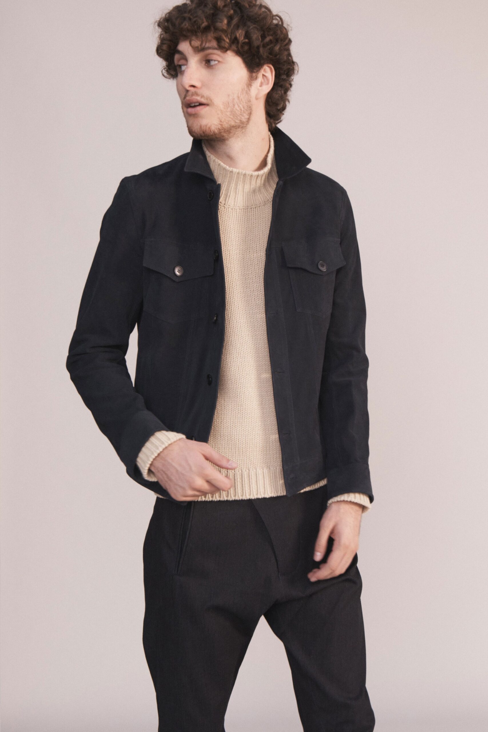 black suede jacket beige sweater tailored pants
