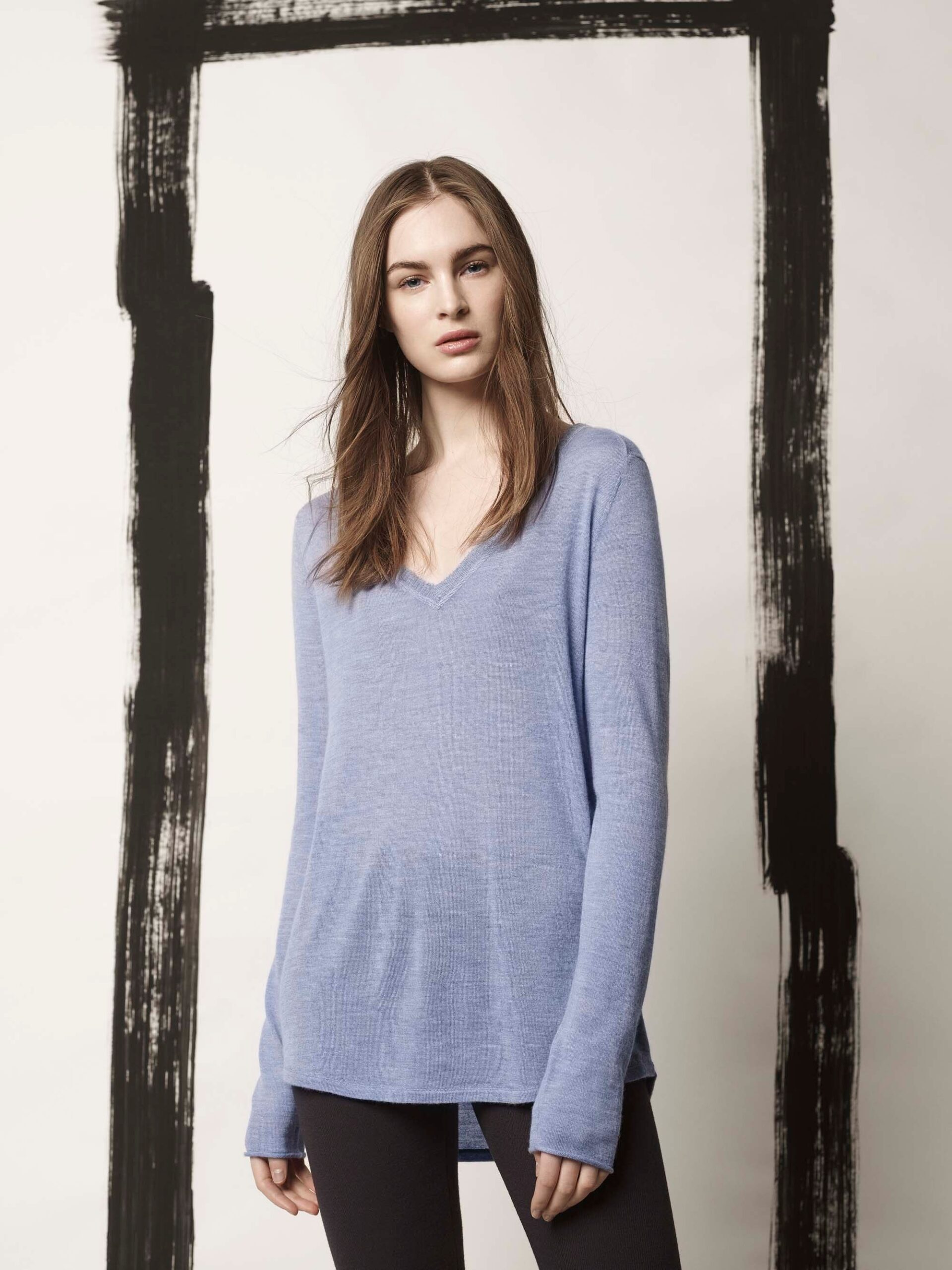 blue relaxed top with black leggings