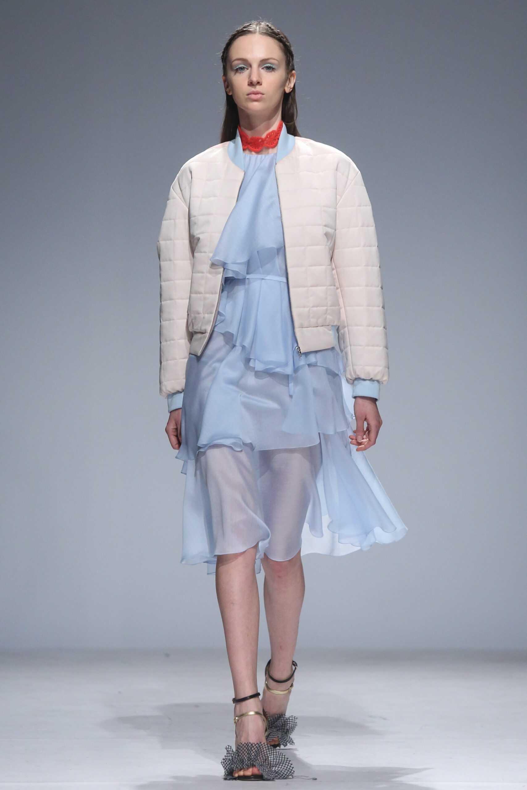 white quilted jacket with blue dress
