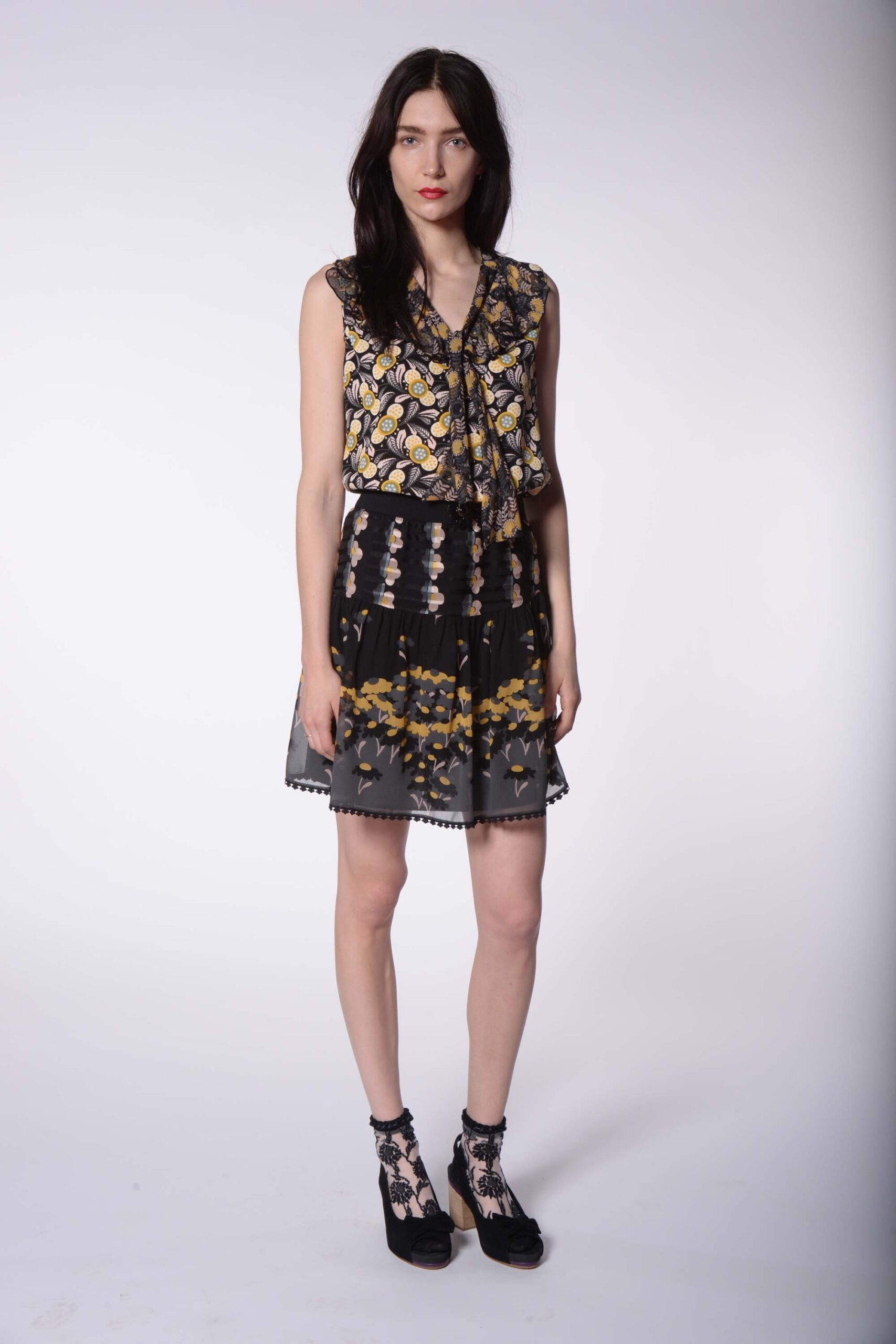 black printed sleeveless top and mini skirt