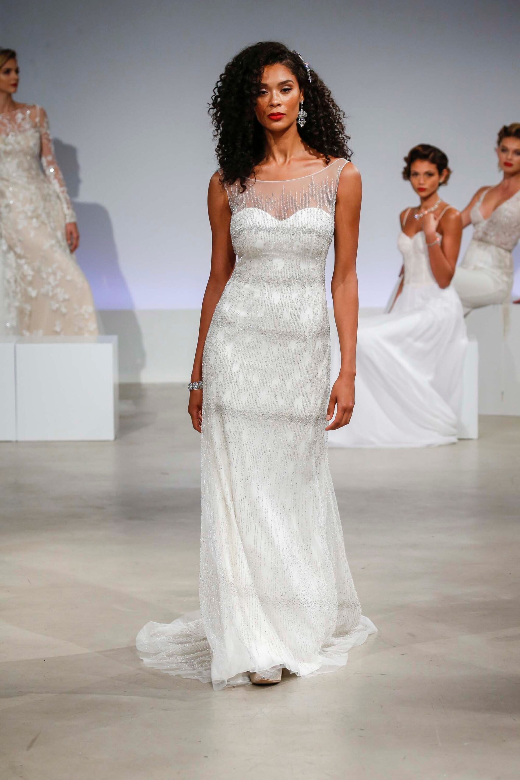 white embellished sleeveless gown