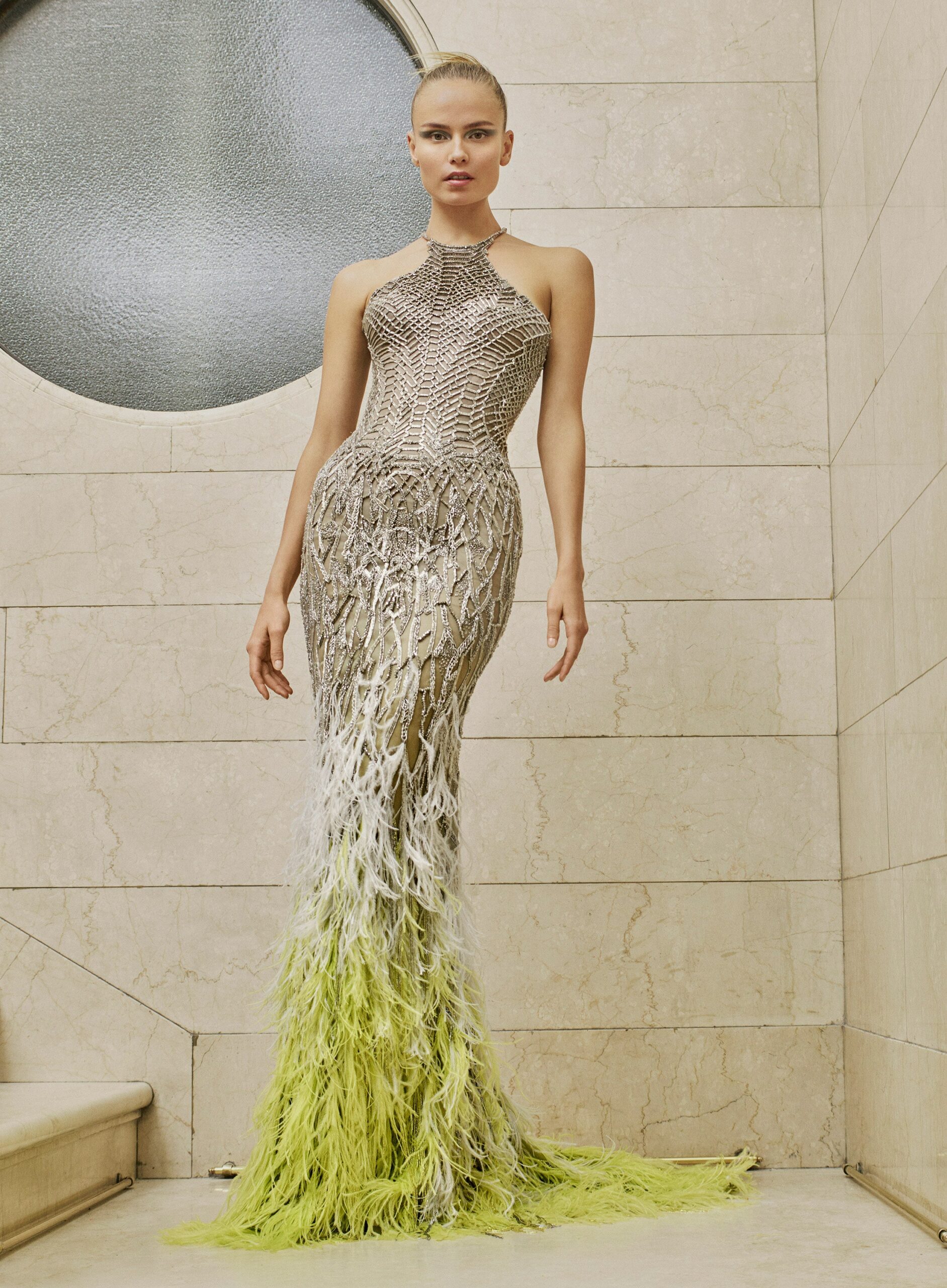 silver and green feathered gown