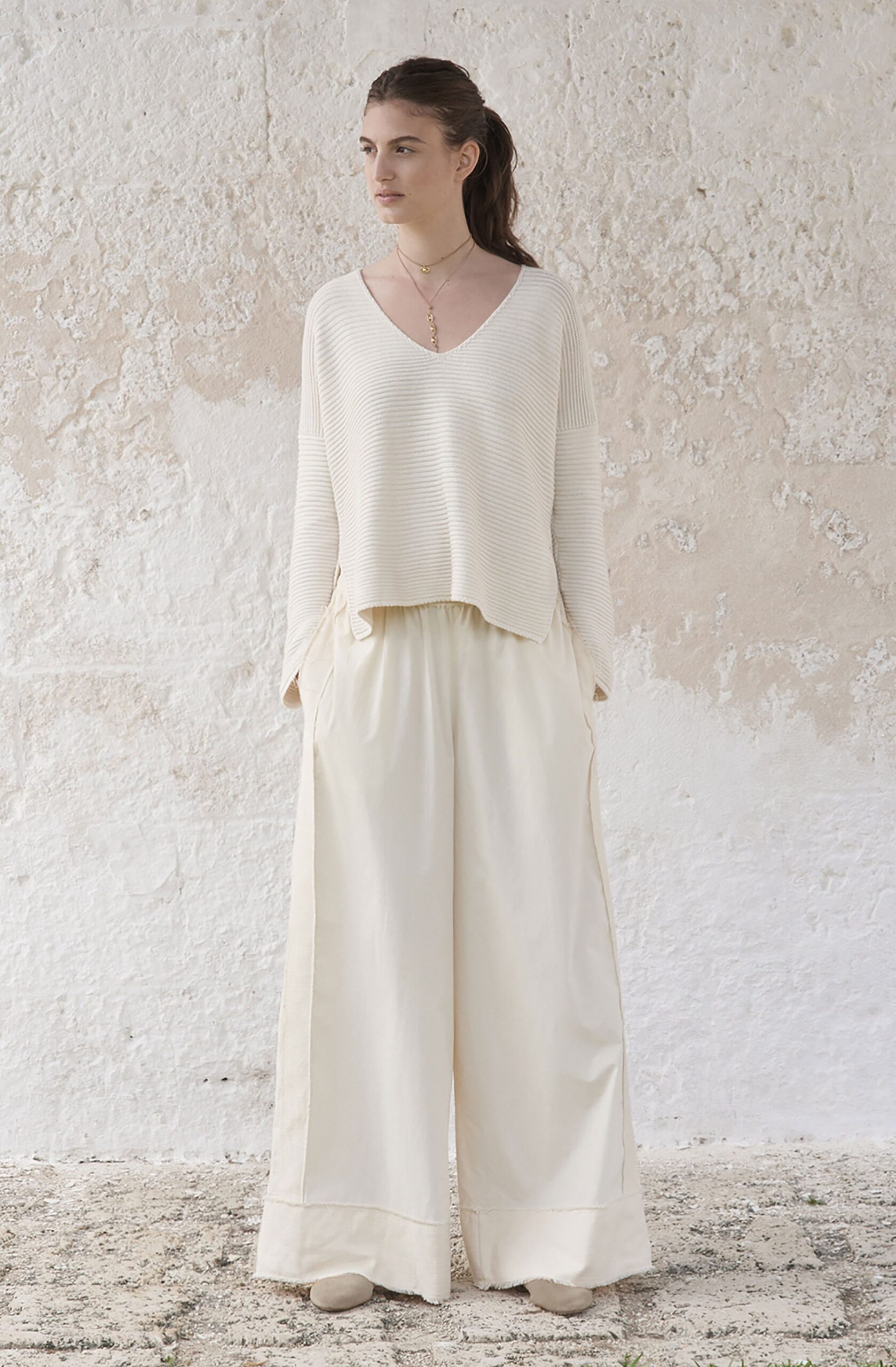 white relaxed top with beige pants