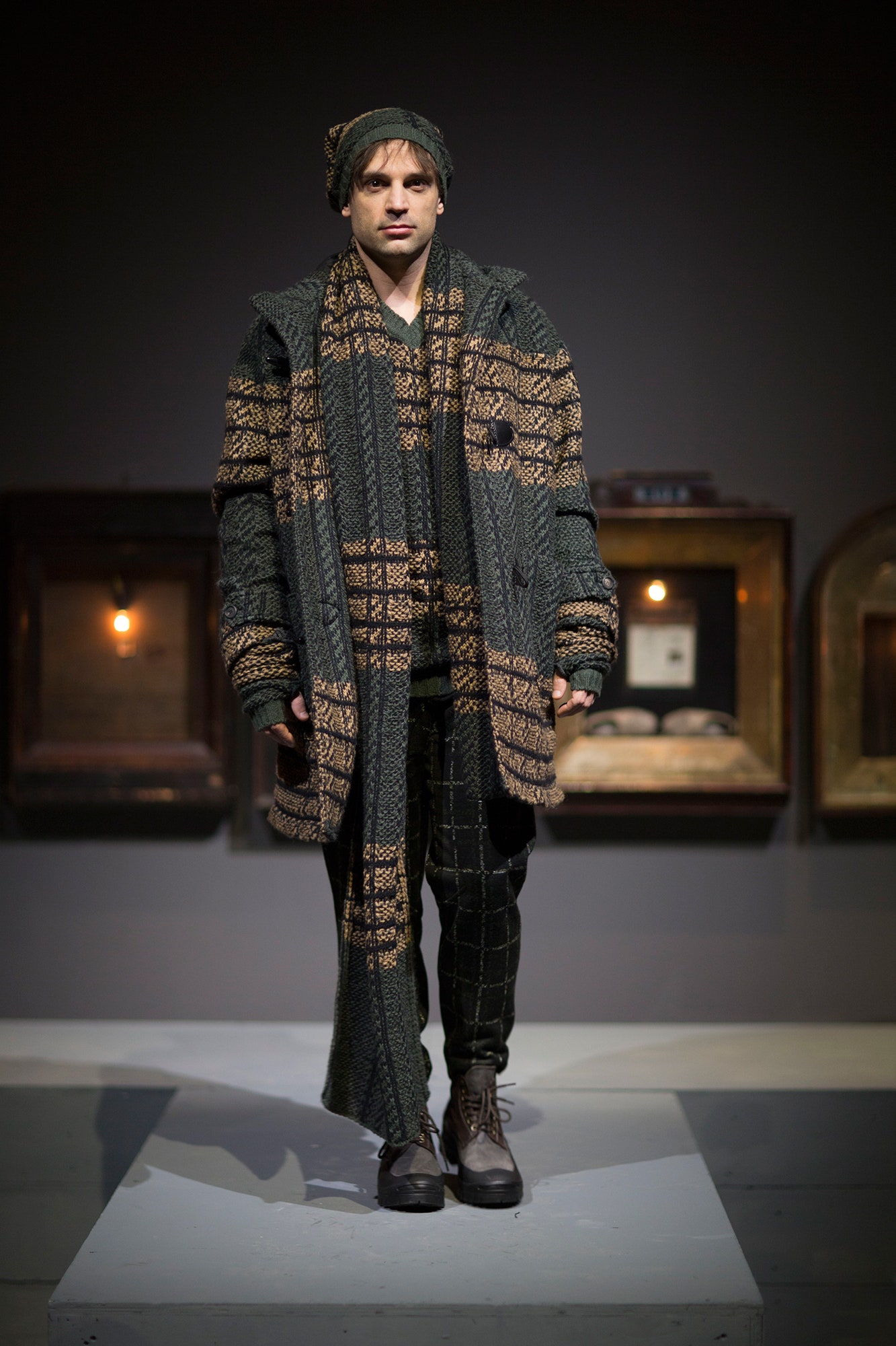 green wool coat with striped sweater