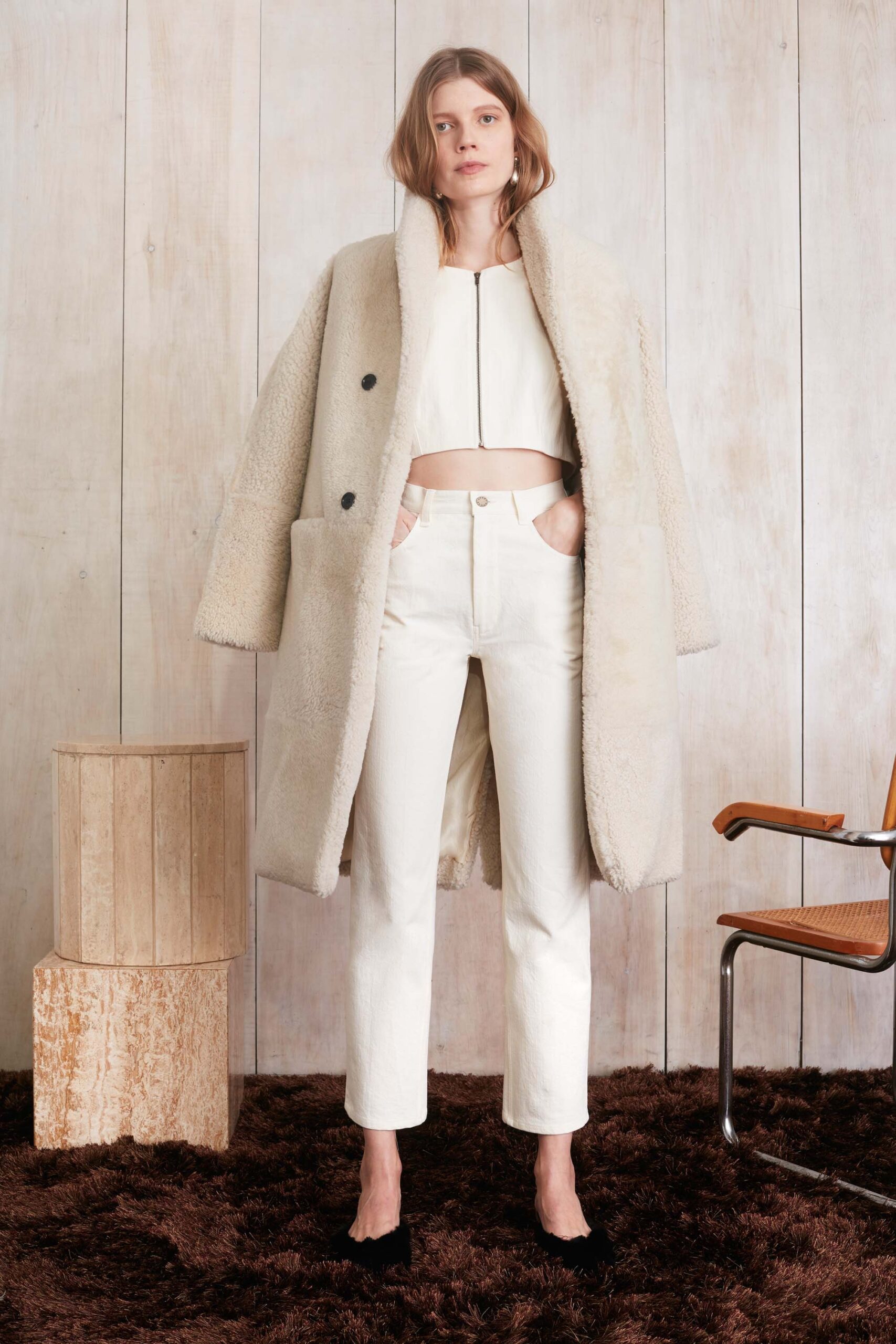 beige faux-fur oversized coat with white top and tailored pants