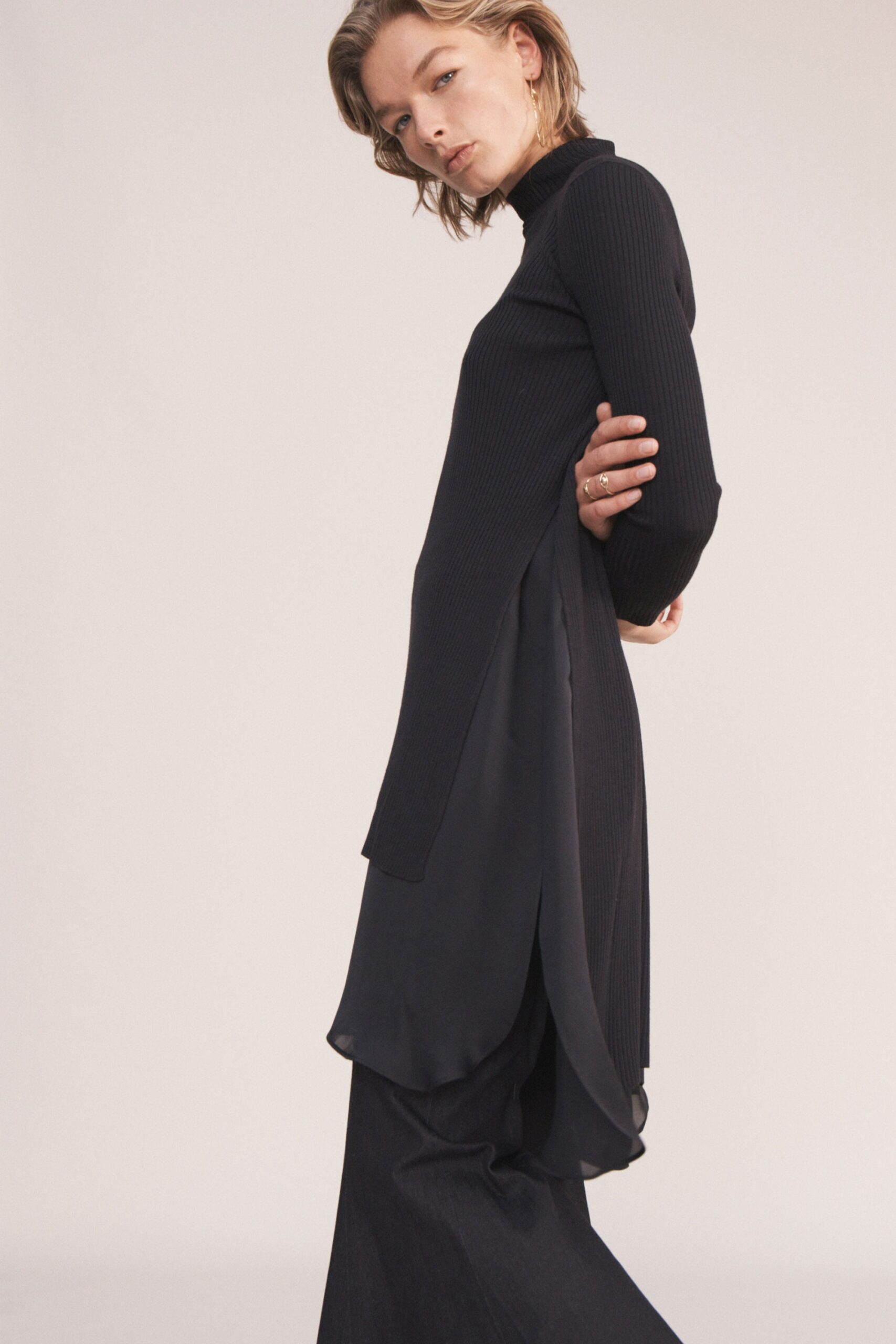 black fitted top and flared pants