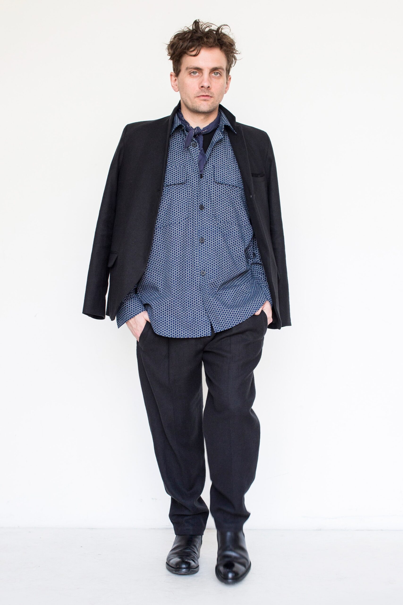 black tailored blazer with blue shirt