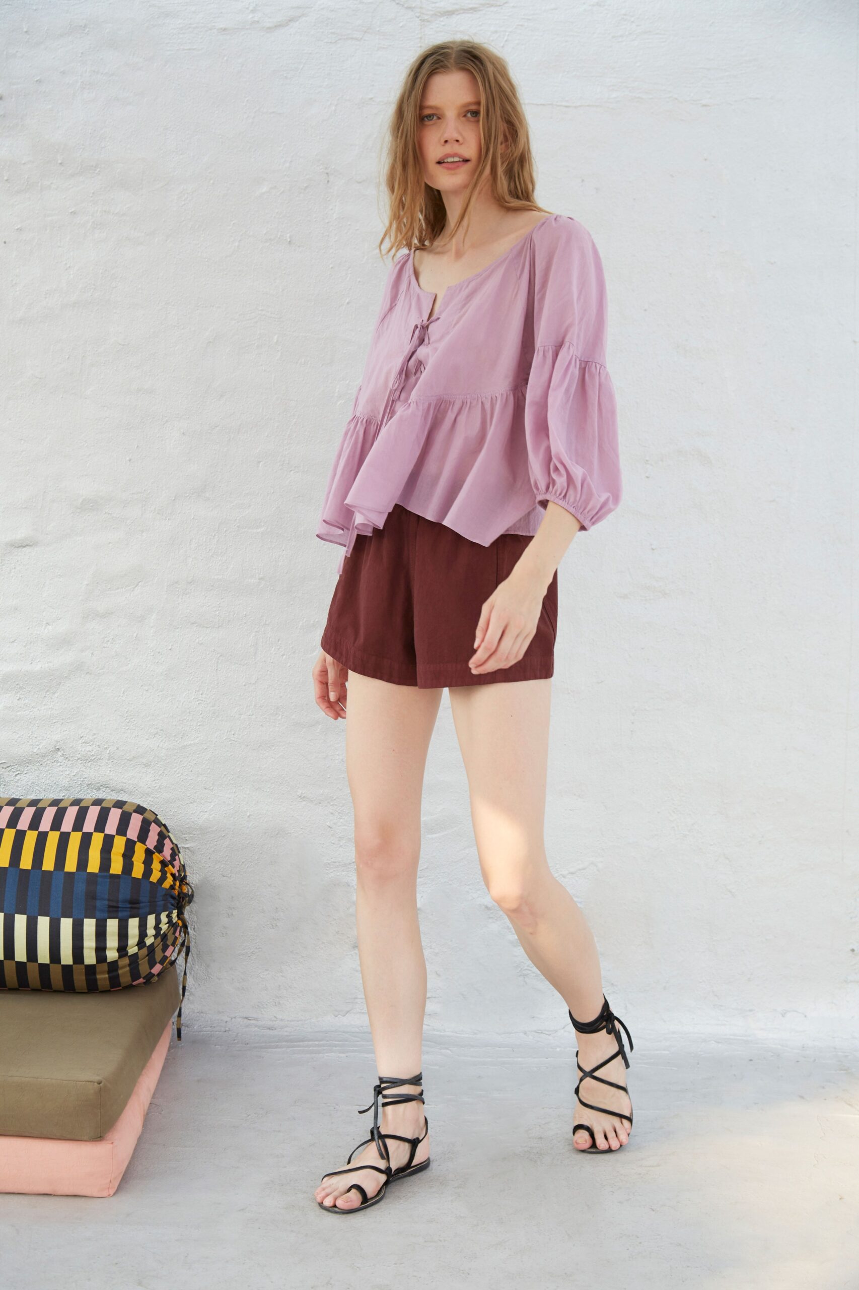 pink relaxed top with brown shorts