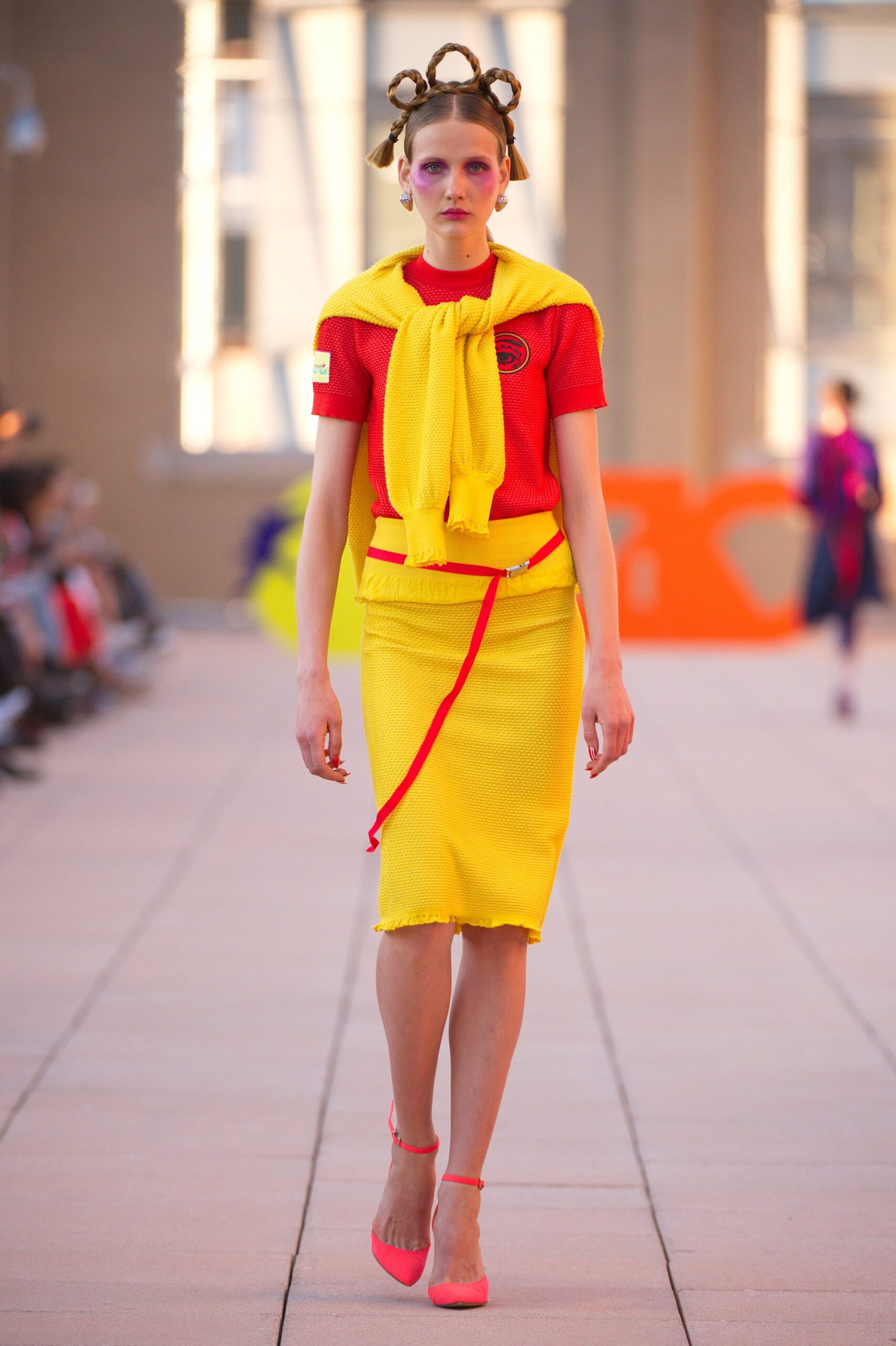 red fitted top with yellow pencil skirt