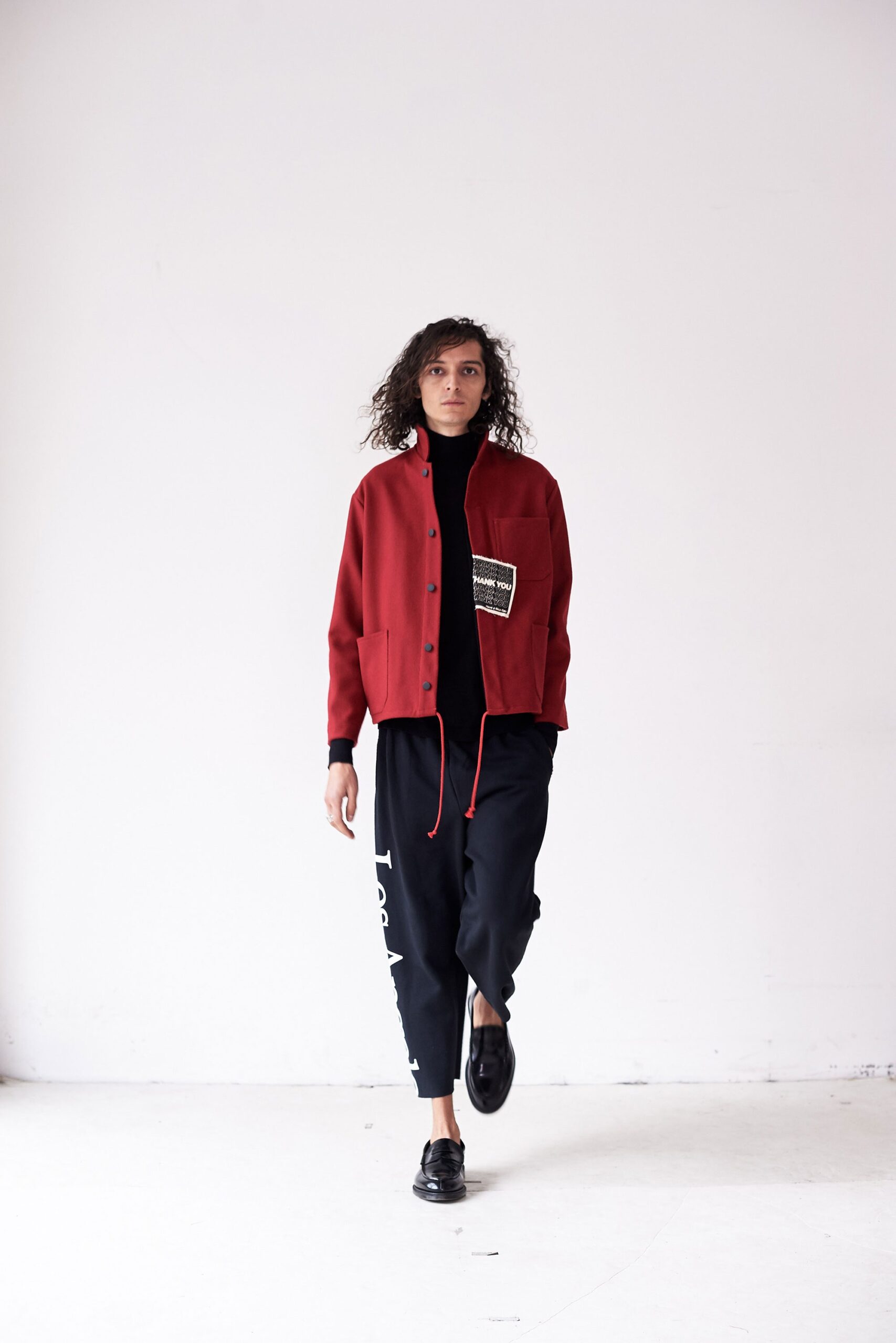 red jacket black top black pants