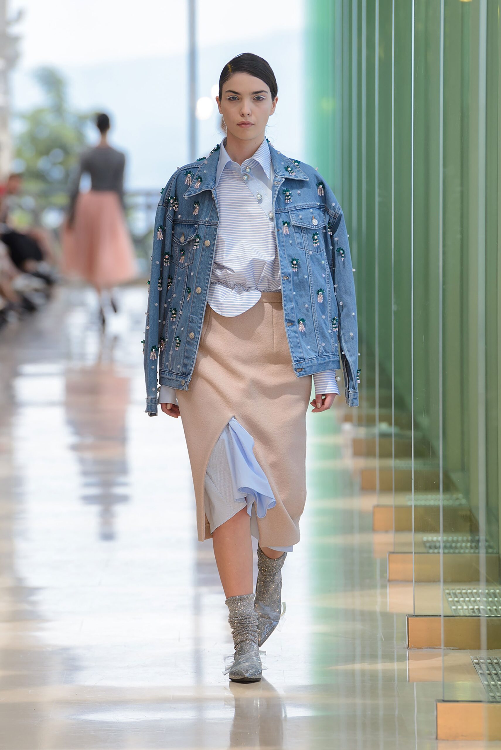 blue denim jacket with beige skirt