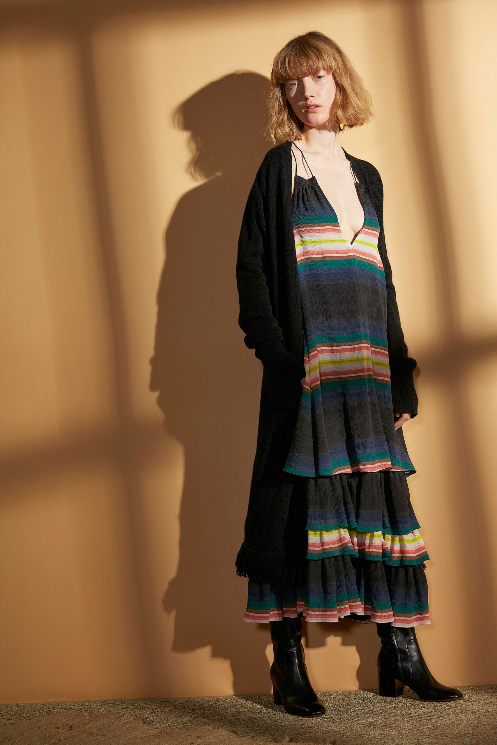 multi-colored tiered dress with black cardigan