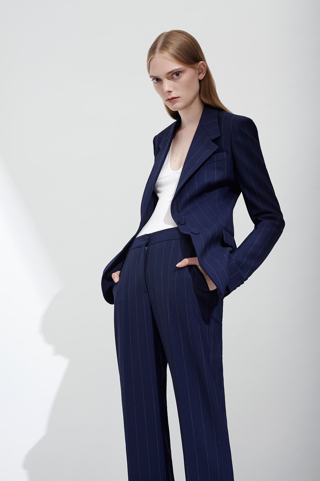 blue tailored suit with white top