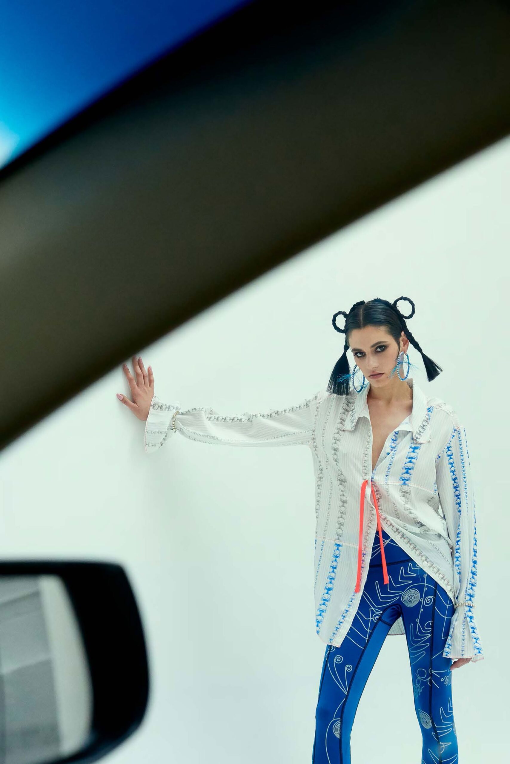 white embroidered shirt and blue leggings