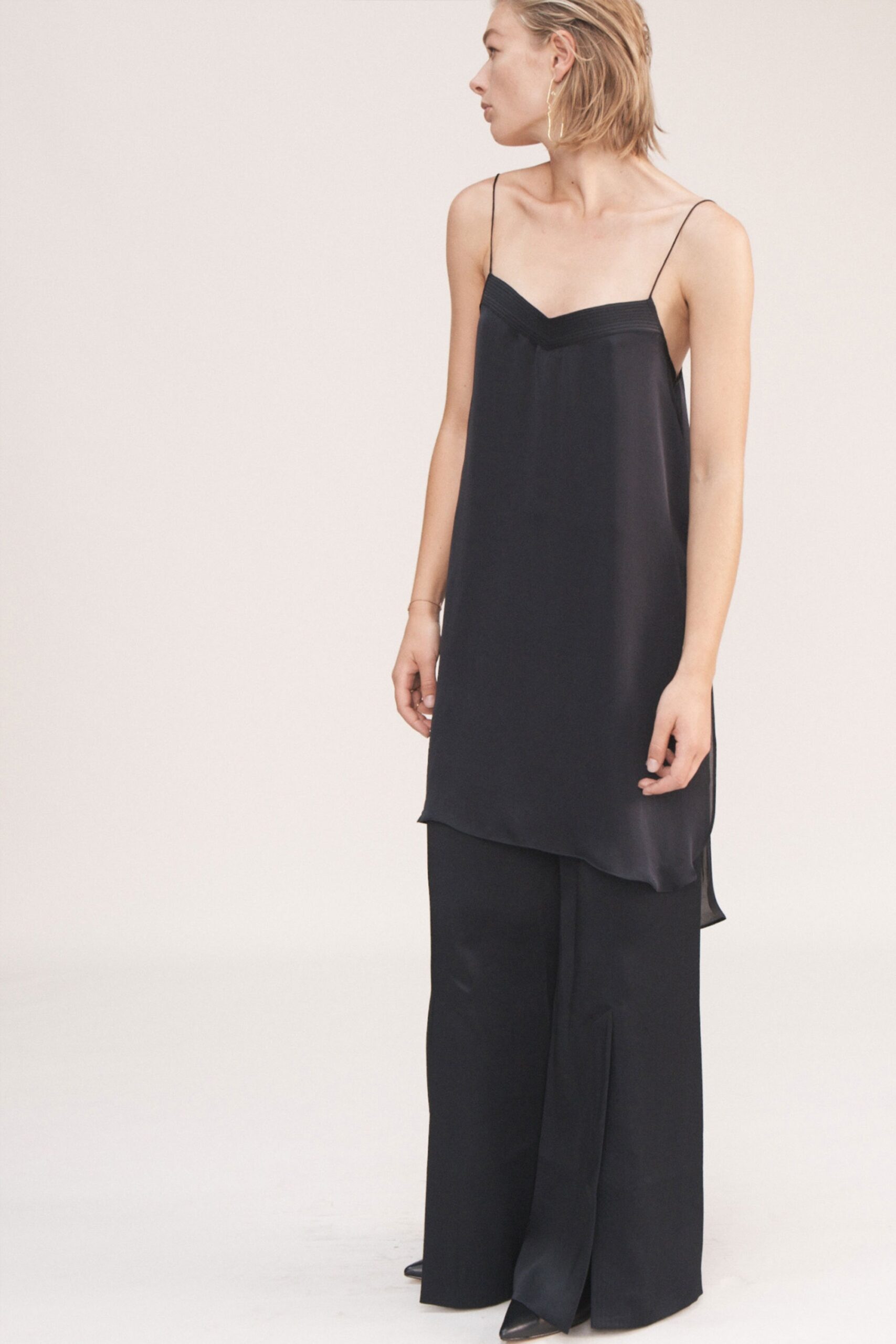 black silk relaxed top and fitted pants