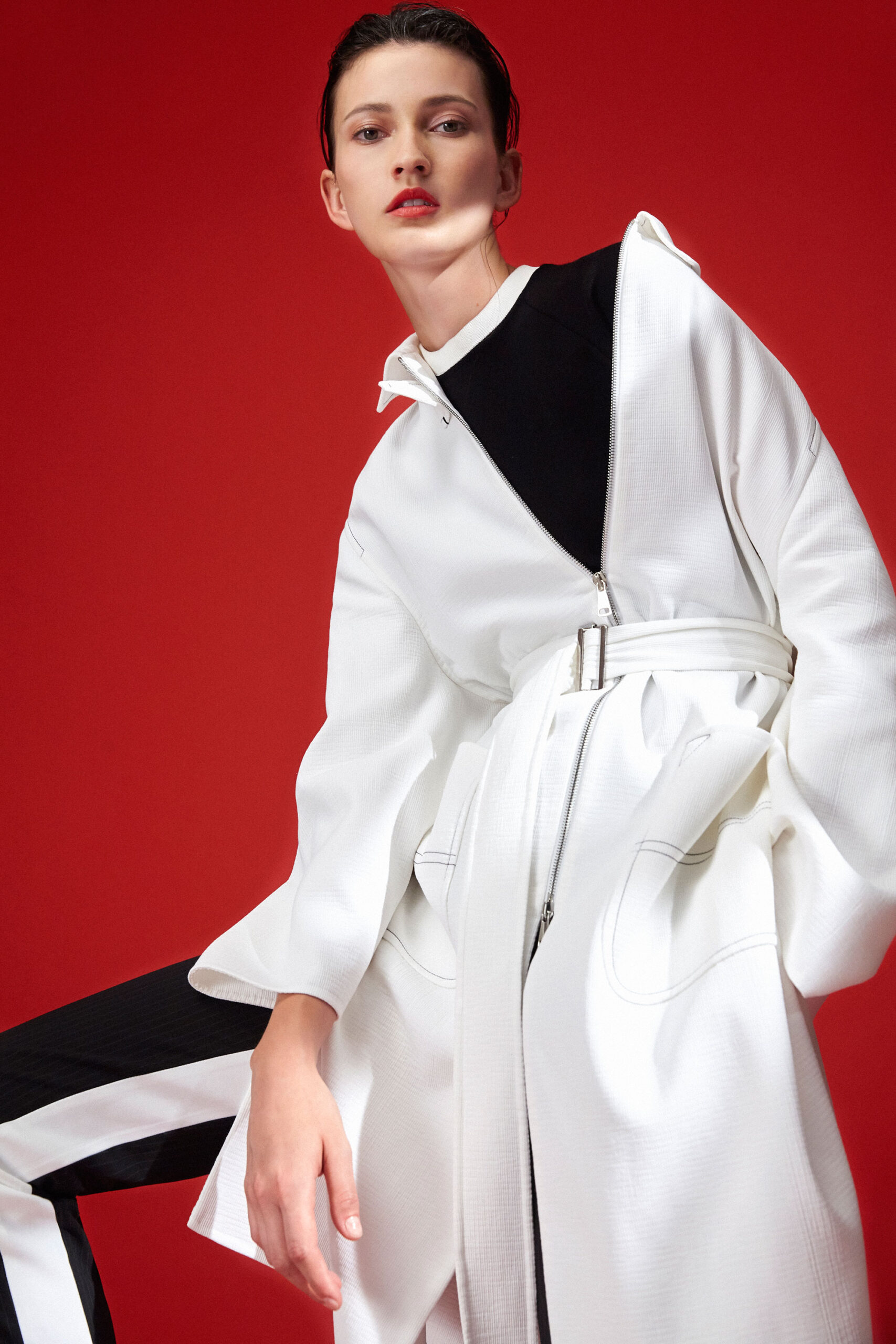 white coat black top and pants