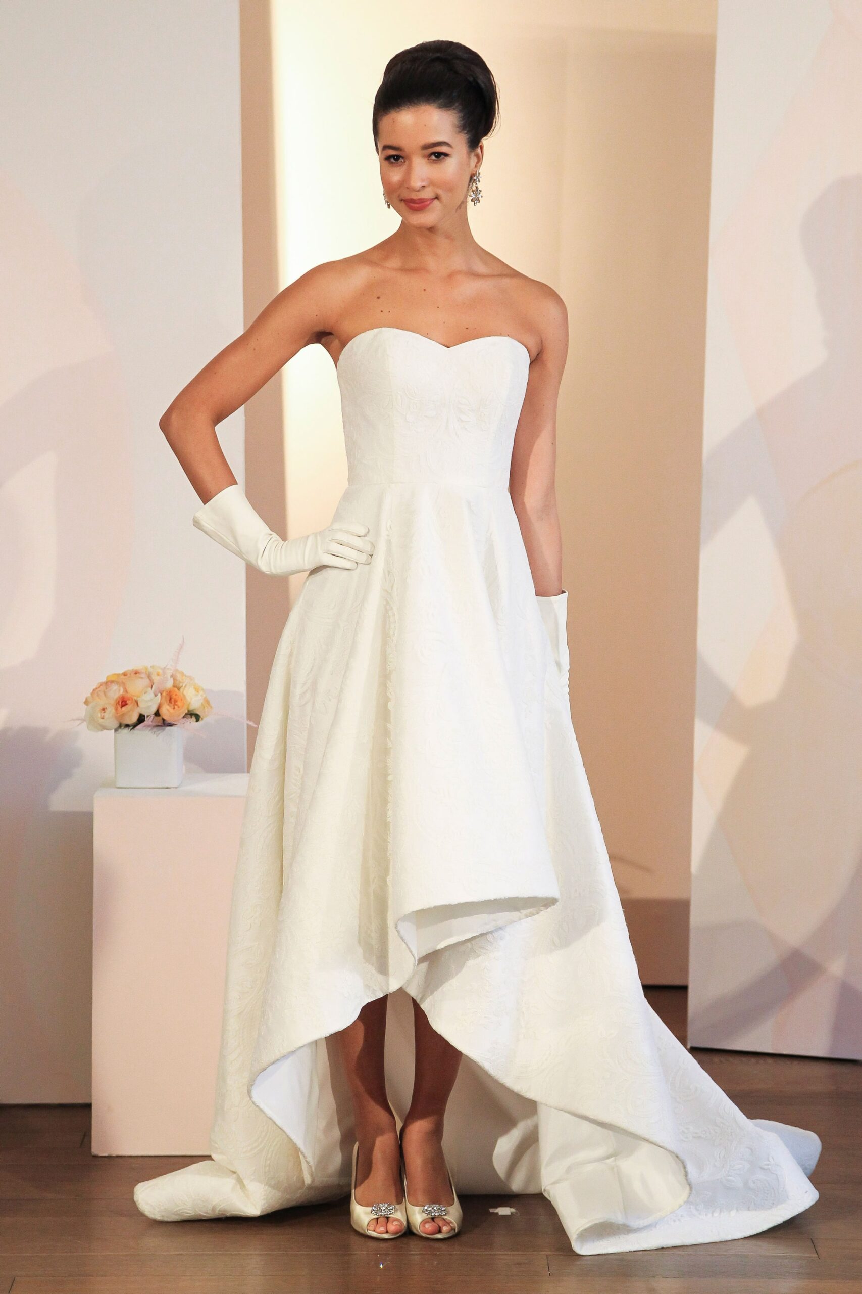 white strapless gown with gloves