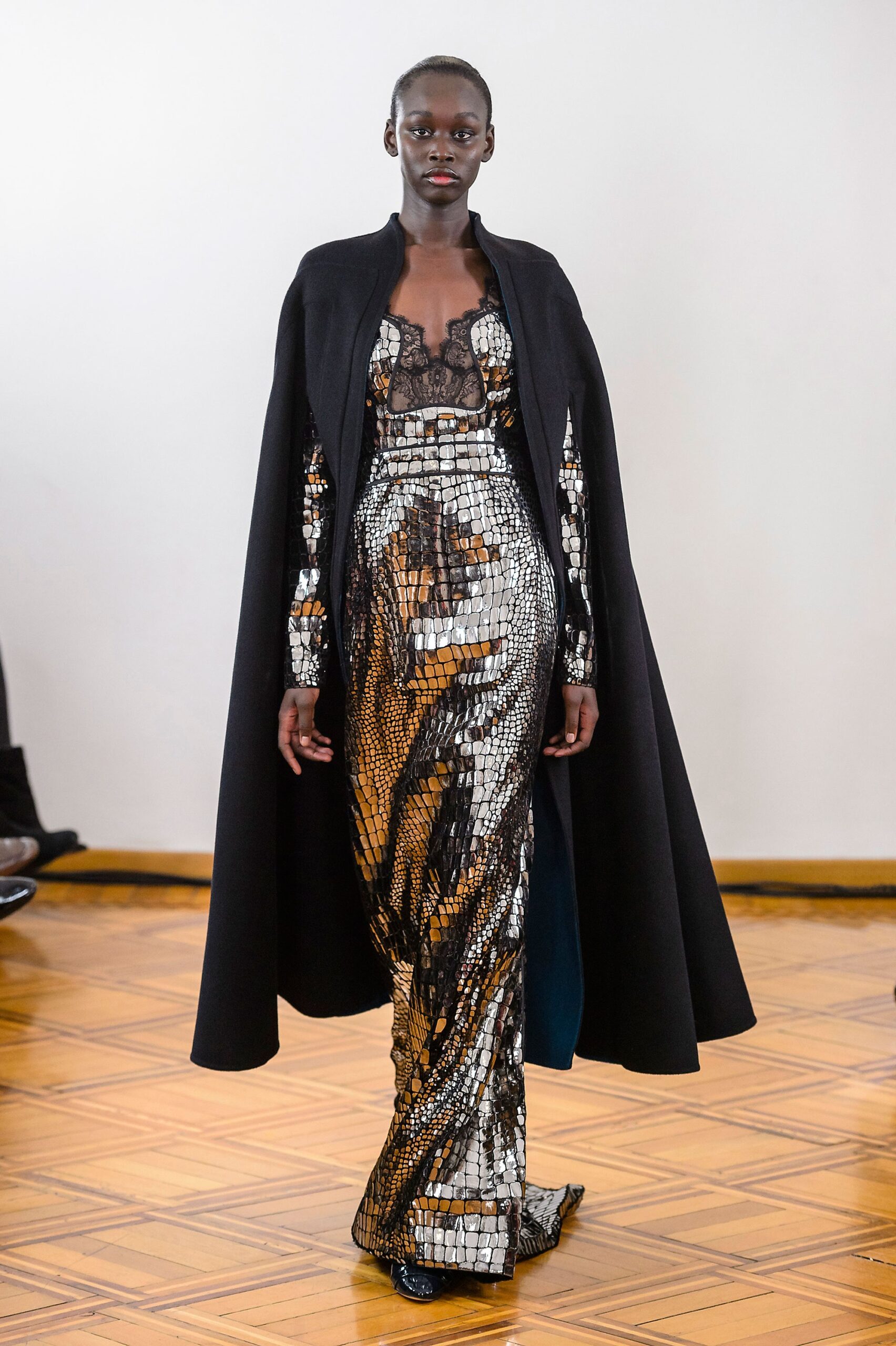black sequined gown with cape