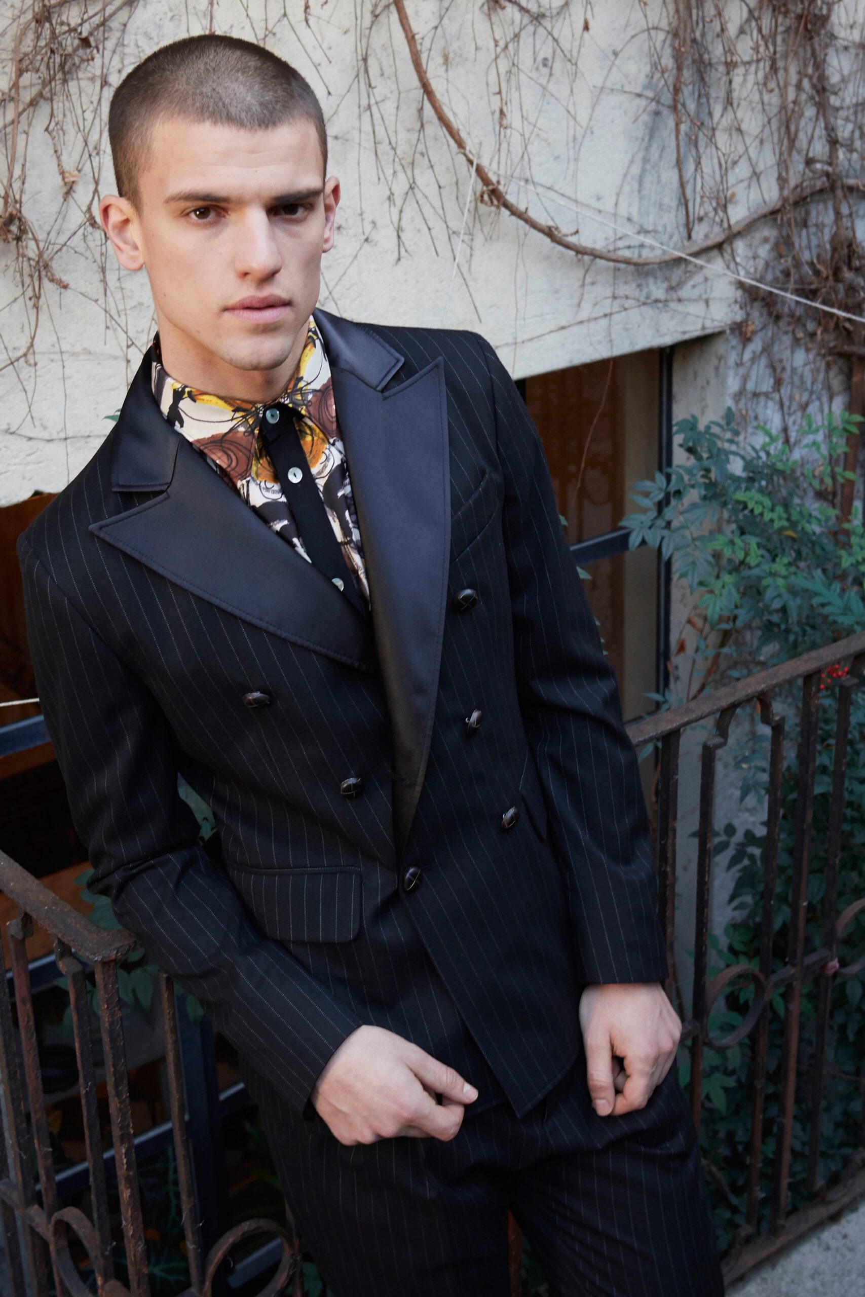black tailored suit with printed shirt